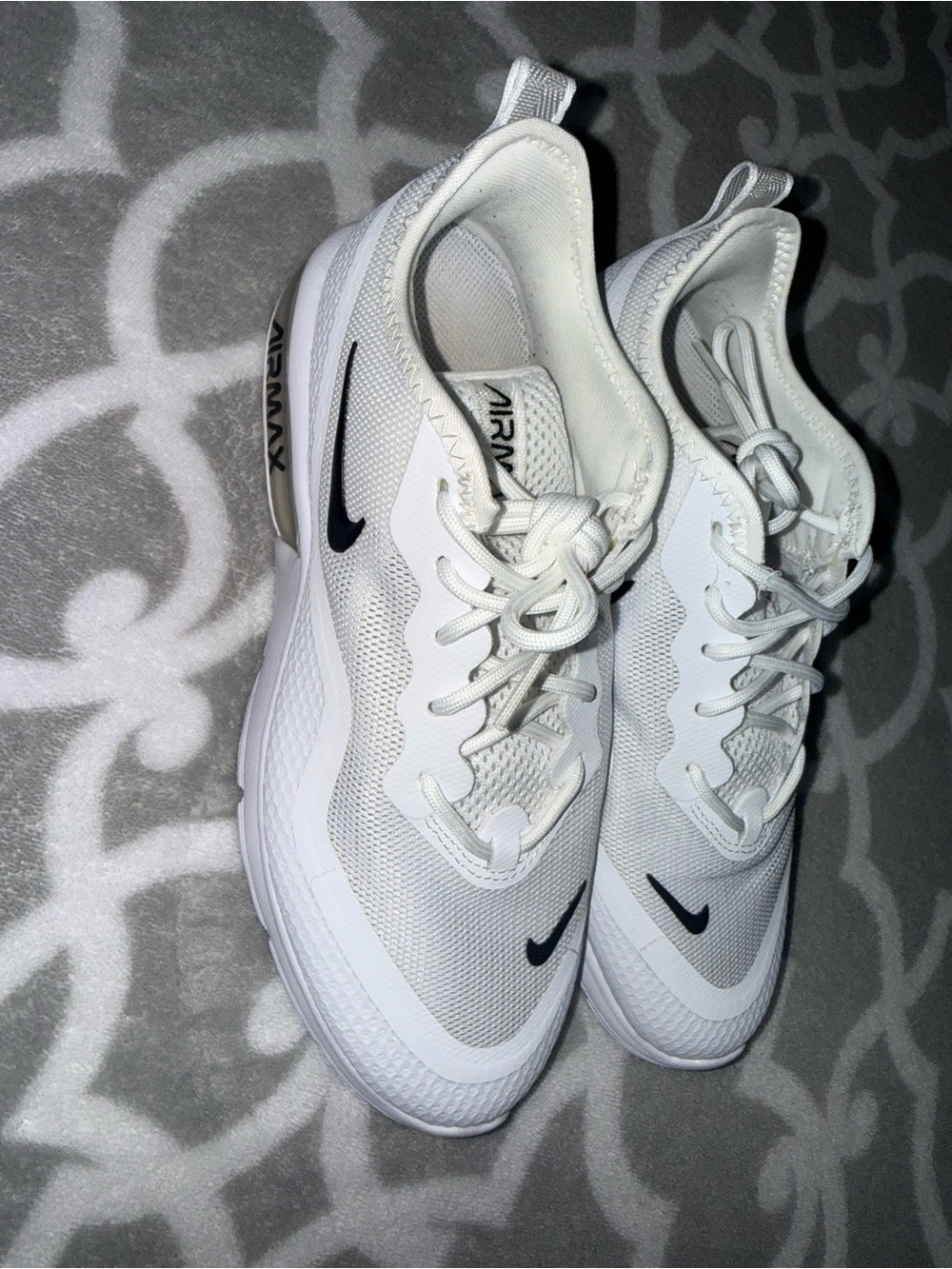Nike Men’s White Athletic Sneakers with Black Swoosh